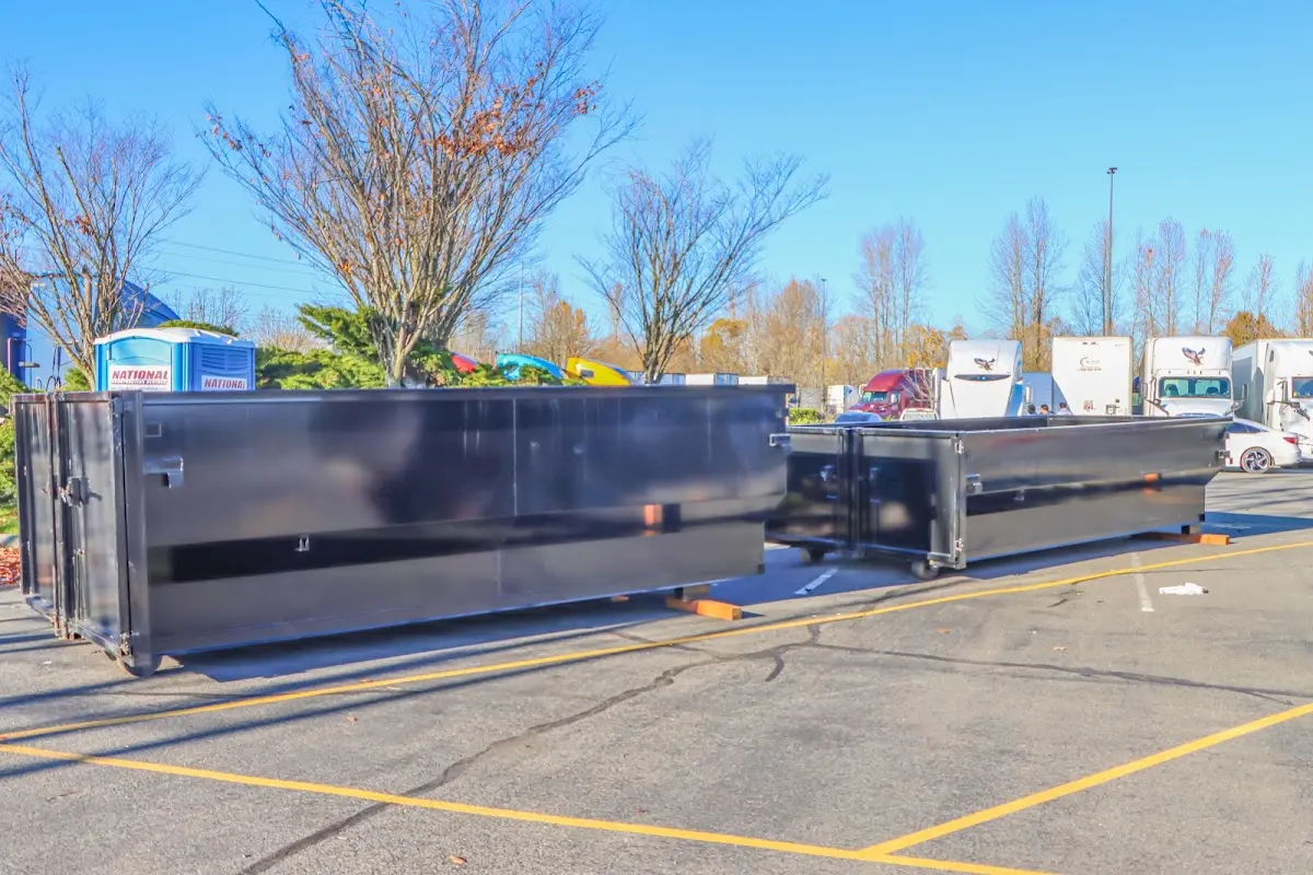 Professional dumpster rental service with roll-off container on residential driveway in Glenview